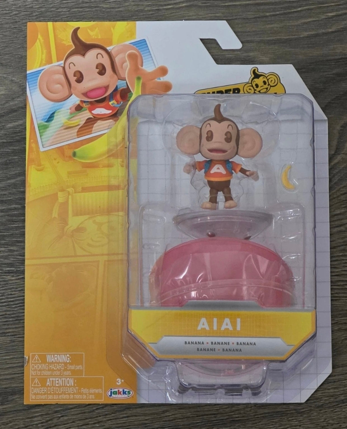 AiAi figure with banana accessory and monkey ball in packaging