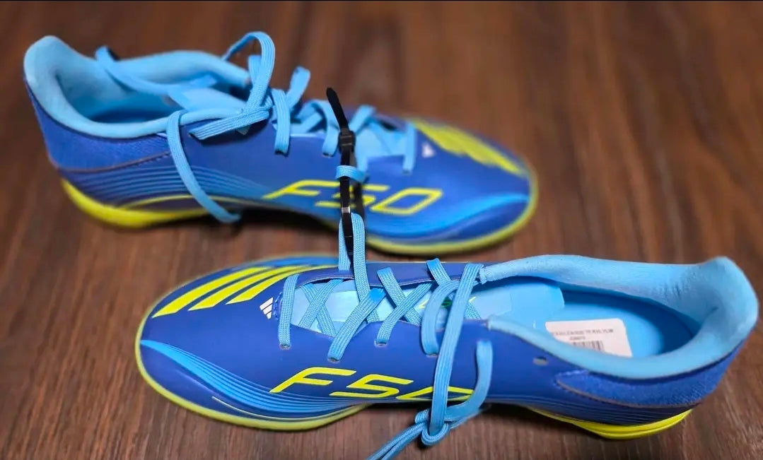 New Adidas F50 Messi League turf soccer shoes in blue and yellow