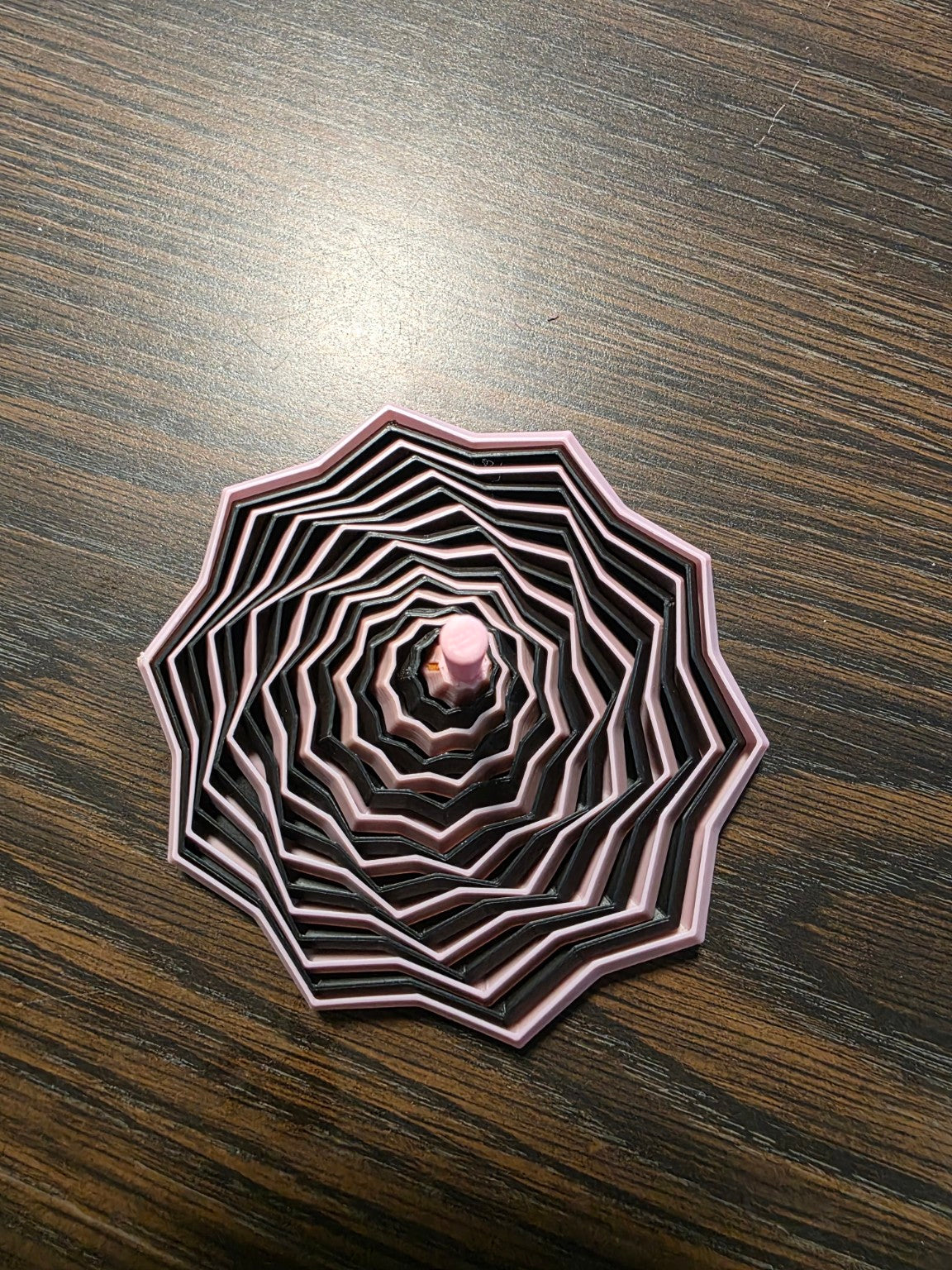 3D printed fidget toy in pink and black
