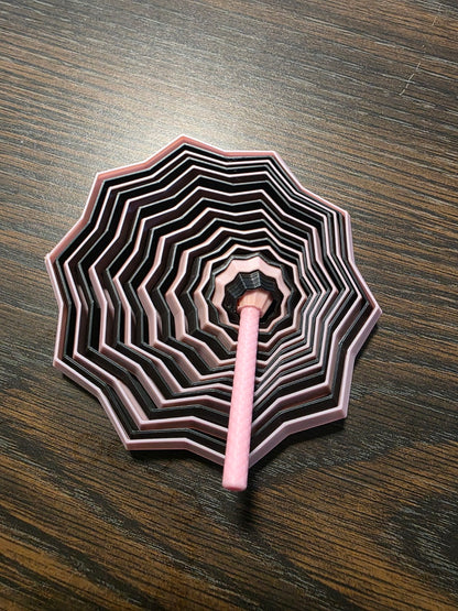 3D printed fidget toy in pink and black