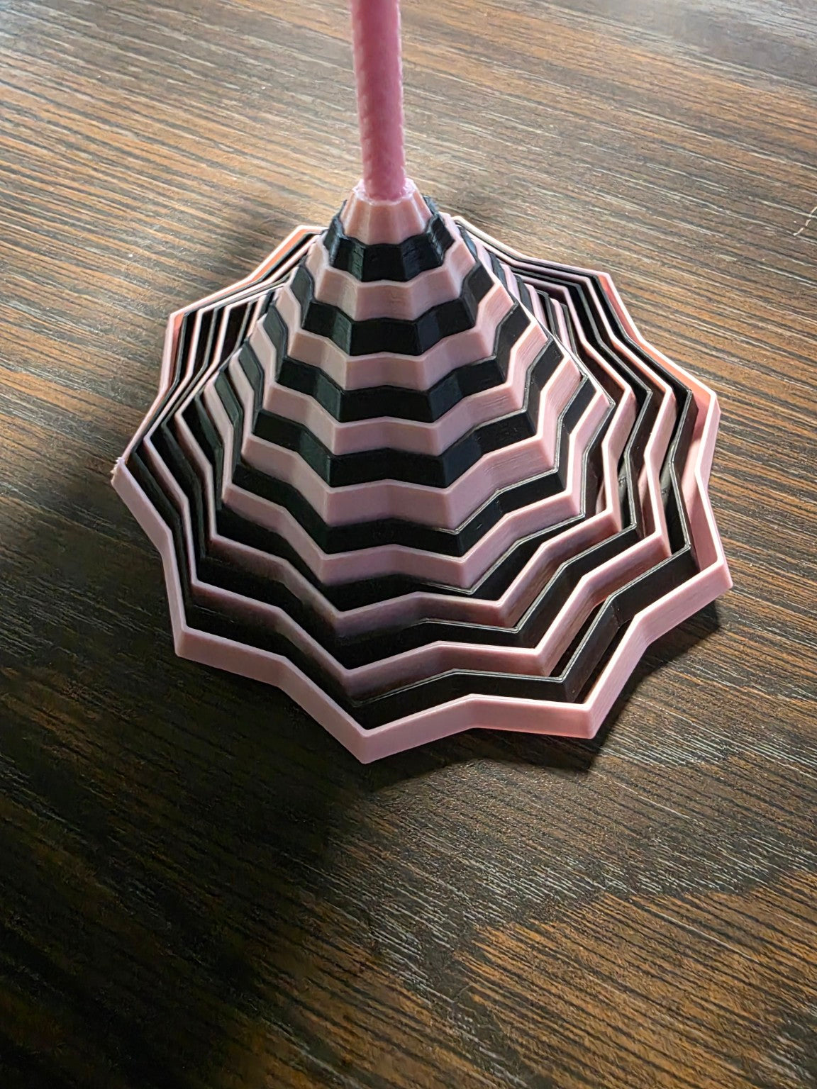3D printed fidget toy in pink and black