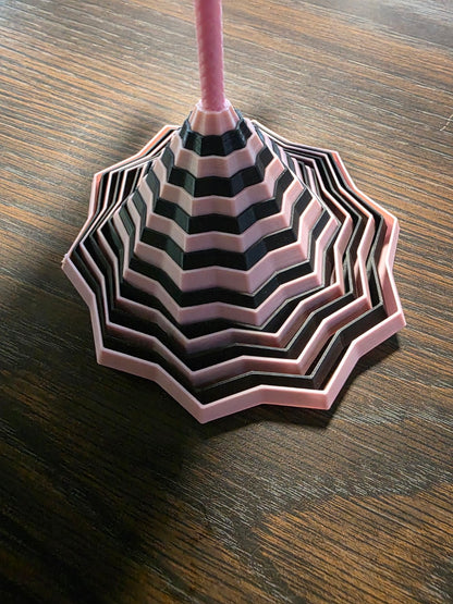 3D printed fidget toy in pink and black