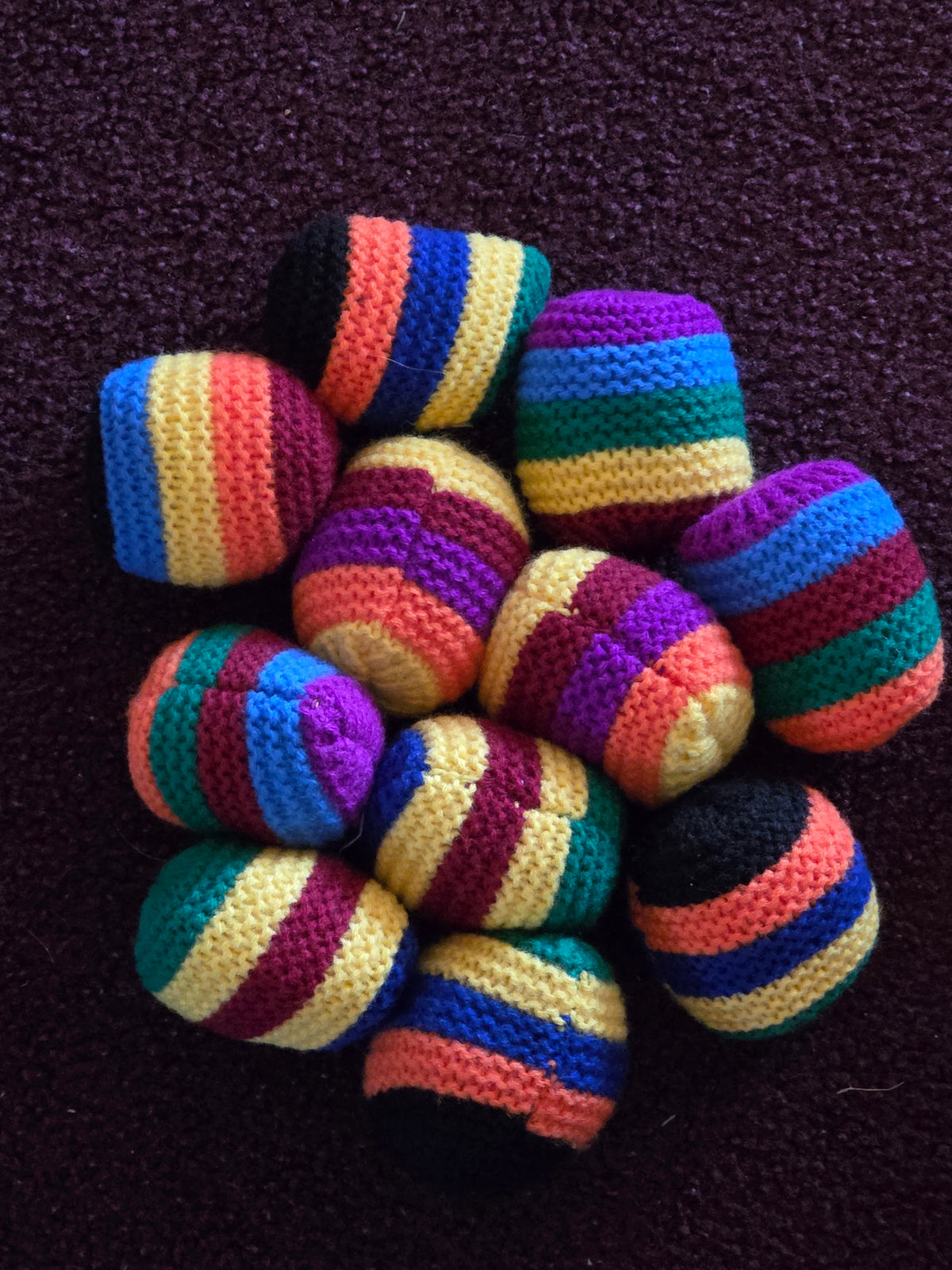 All 11 colorful crocheted hacky sacks